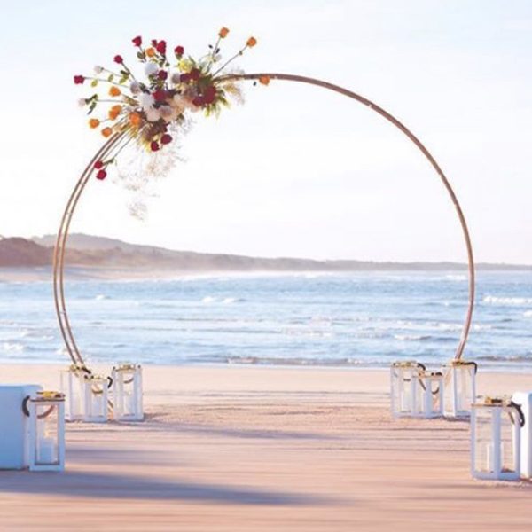 gold-circle-beach-garden-indoor-wedding-ceremony-bridal-arch-front